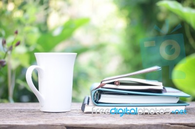 Notebook And Coffee Cup On Wooden Table Stock Photo Notebook And Coffee Cup On Wooden Table Stock Photo