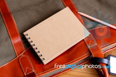 Notebook On Travel Bag Stock Photo