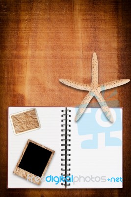 Notebook On Wood With Star Stock Photo