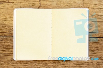 Notebook  On Wooden Table Stock Photo