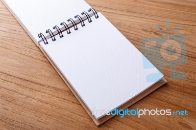 Notebook Open On Wood Table Stock Photo