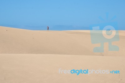 Nudist Walking On The Sand Dunes Near Mas Palomas Gran Canaria Stock Photo