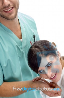 Nurse Checking Pulse Of Patient Stock Photo