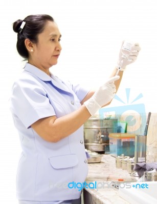 Nurse Holding Syringe Stock Photo