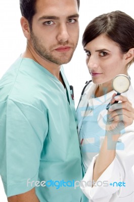 Nurse Standing With Surgeon Stock Photo