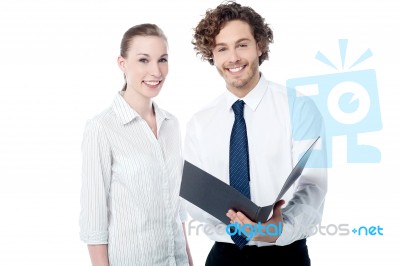 Office Colleagues Reviewing Business File Stock Photo