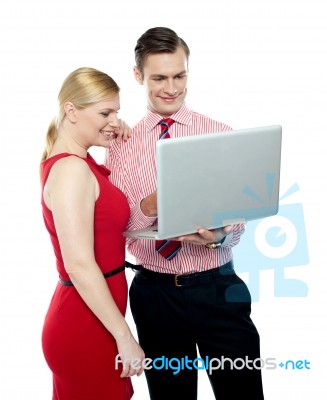 Office Workers Holding Laptop Stock Photo
