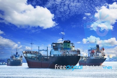 Oil And Industrial Tanker Transport Ship Floating On River Port Stock Photo