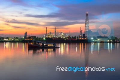 Oil Refinery At Twilight In Bangkok, Thailand Stock Photo
