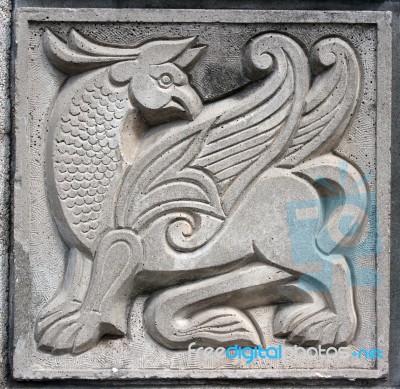Old Bas-relief Of Fairytale Winged Lion Stock Photo