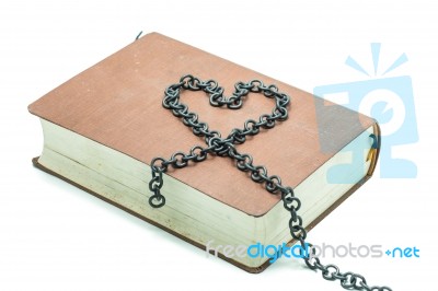 Old Book With Chain In The Shape Of A Heart Isolated On White Ba… Stock Photo