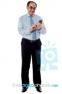 Old Corporate Man Using Cellphone Stock Photo