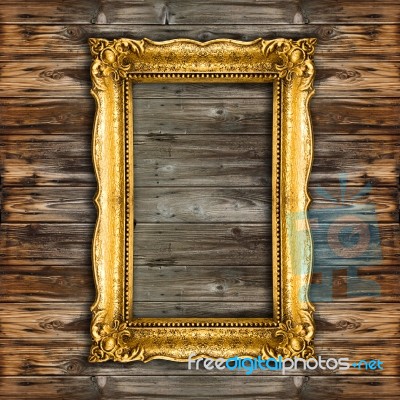 Old Gold Picture Frame On Wooden Background Stock Photo