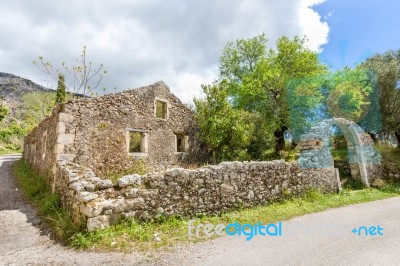 Old Historic House As Ruins Along Road Stock Photo
