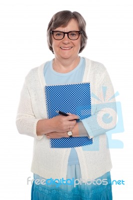 Old Lady Holding notebook Stock Photo