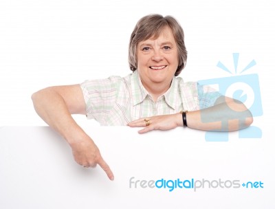 Old Lady Pointing At Blank Board Stock Photo