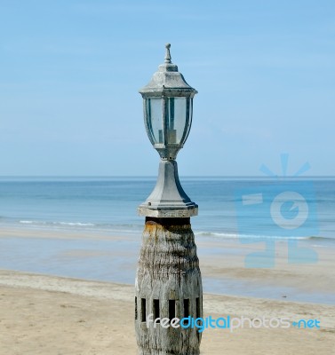 Old Lantern On Sea Beach Stock Photo