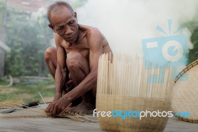 Old Man And Baskets Stock Photo