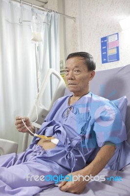 Old Man Patient Feeding Liquid Food On Hospital Bed Stock Photo
