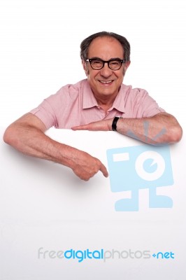 Old Man Pointing At Blank board Stock Photo
