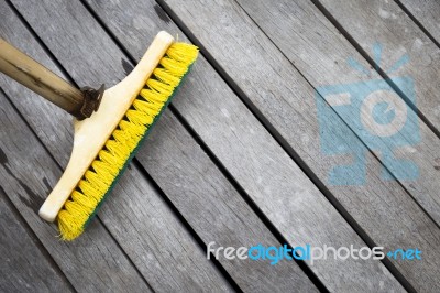Old Plastic Brush With Bamboo Stick Stock Photo