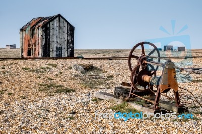 Old Shack And Rusty Machinery On Dungeness Beach Stock Photo