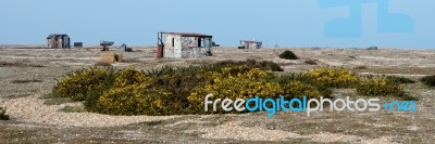 Old Shacks And Boats On Dungeness Beach Stock Photo