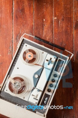 Old Tape Recorder On Wooden Background Stock Photo