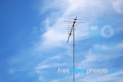 Old Television Antenna Against Blue Colorful Sky Stock Photo