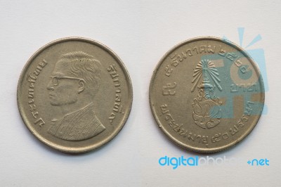 Old Thai Coin On White Background, 5 Baht, B.e. 2520 Stock Photo