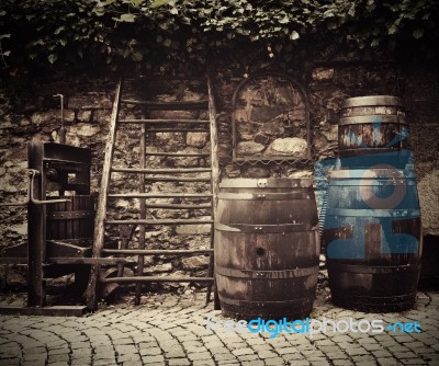 Old Traditional Wine Press And Oak Barrels Stock Photo