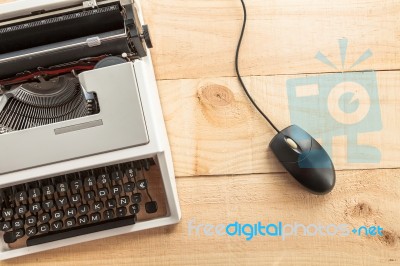 Old Typewriter Connected To A Computer Mouse Stock Photo