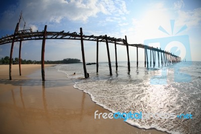 Old Wooden Bridge And Beach Stock Photo