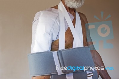 Older Man With Arm In Sling Stock Photo