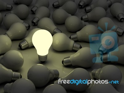 One Lit Light Bulb Stock Image