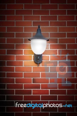 Open Light Lamp On Brick Wall Stock Photo