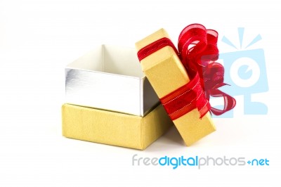 Opened Gift Box And Red Ribbon Stock Photo