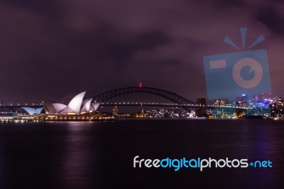 Opera House And Harbour Bridge In Sydney At Night, It Is Illumin… Stock Photo