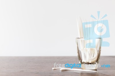 Oral Device : Dental Floss In Glass On Wooden Background Stock Photo Oral Device : Dental Floss In Glass On Wooden Background Stock Photo