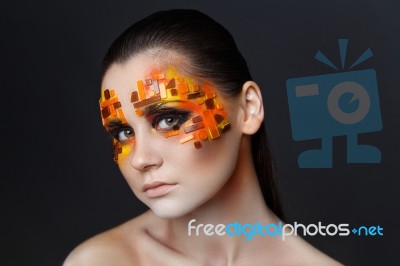 Orange And Red Rhinestones On A Girl Face Stock Photo