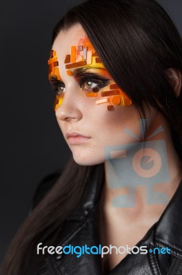 Orange And Red Rhinestones On A Girl Face Stock Photo