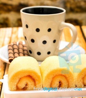 Orange Cakes Coffee Indicates Swiss Rolls And Break Stock Photo
