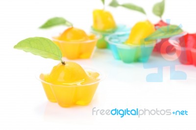 Orange Deletable Imitation Fruits In Jelly Cup On White Floor Stock Photo