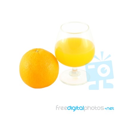 Orange Juice In Brandy Glass And Fruit On White Background Stock Photo