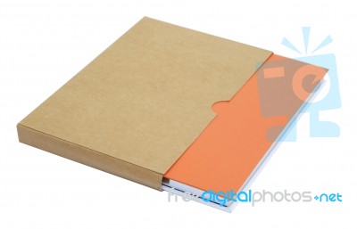 Orange Notebook In Brown Paper Case Isolated On White Background… Stock Photo