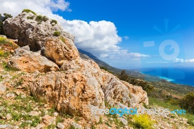 Orange Rocks On Mountain At Greek Coast Stock Photo