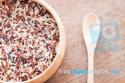 Organic Dry Multi Grain Rice In Wooden Bowl Stock Photo