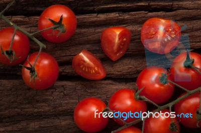 Organic Fresh Cherry Tomatoes On Wooden Background Stock Photo