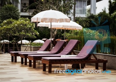 Outdoor Couches With Umbrellas Stock Photo