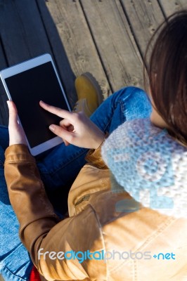 Outdoor Portrait Of Young Woman With Digital Tablet Stock Photo